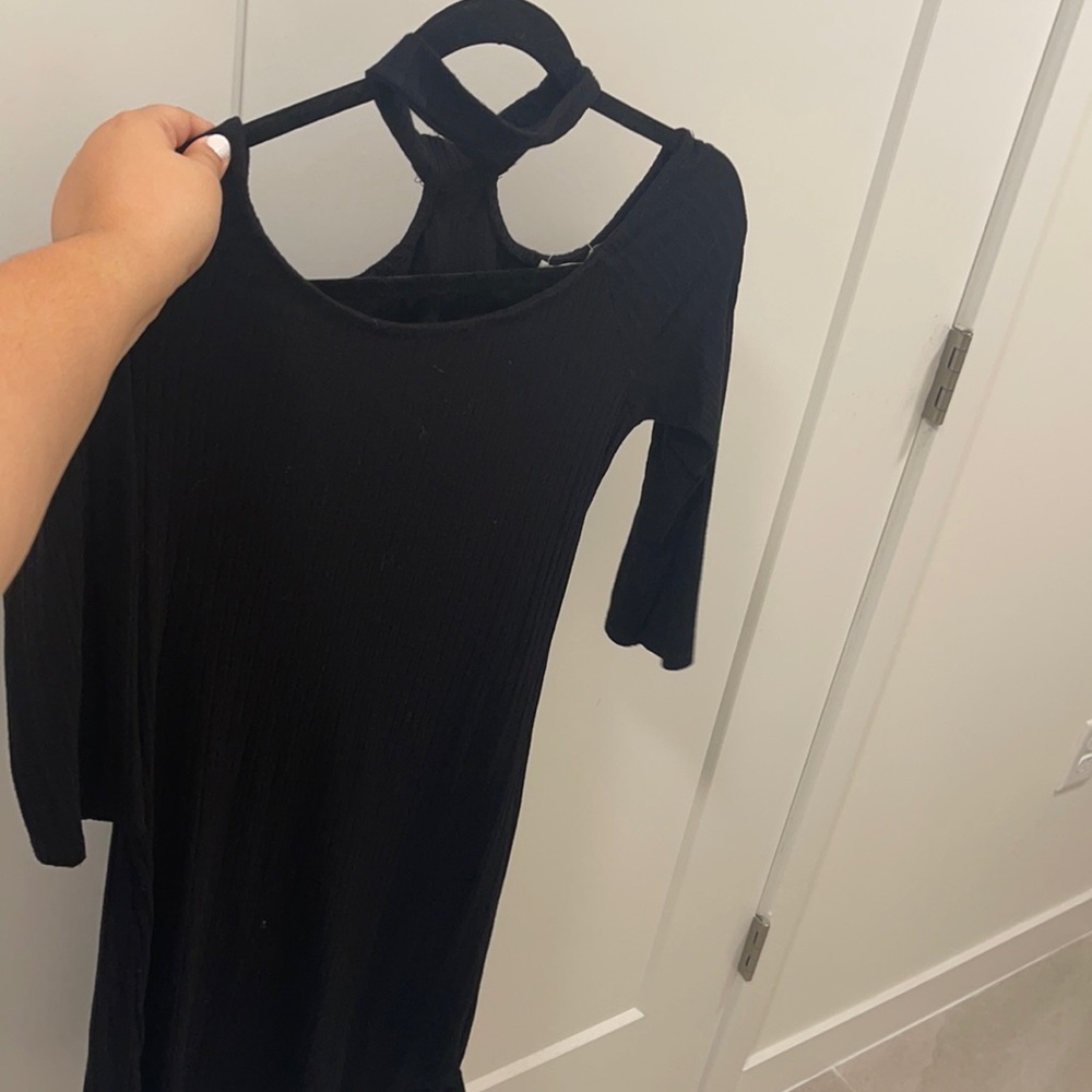 Mid length black dress with 3/4 sleeves and a choker attached